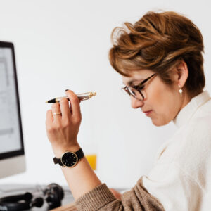 concentrated-adult-female-thinking-about-business-project-in-office