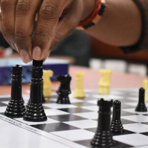 black and yellow chess pieces